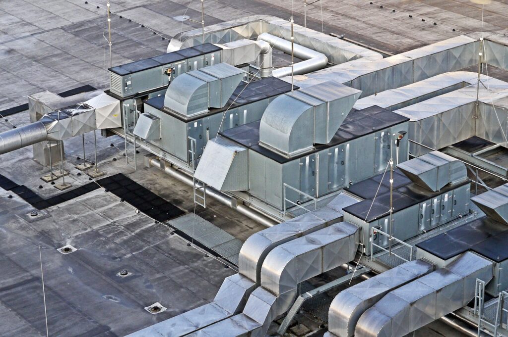 Industrial ventilation and HVAC air duct system on a factory roof
